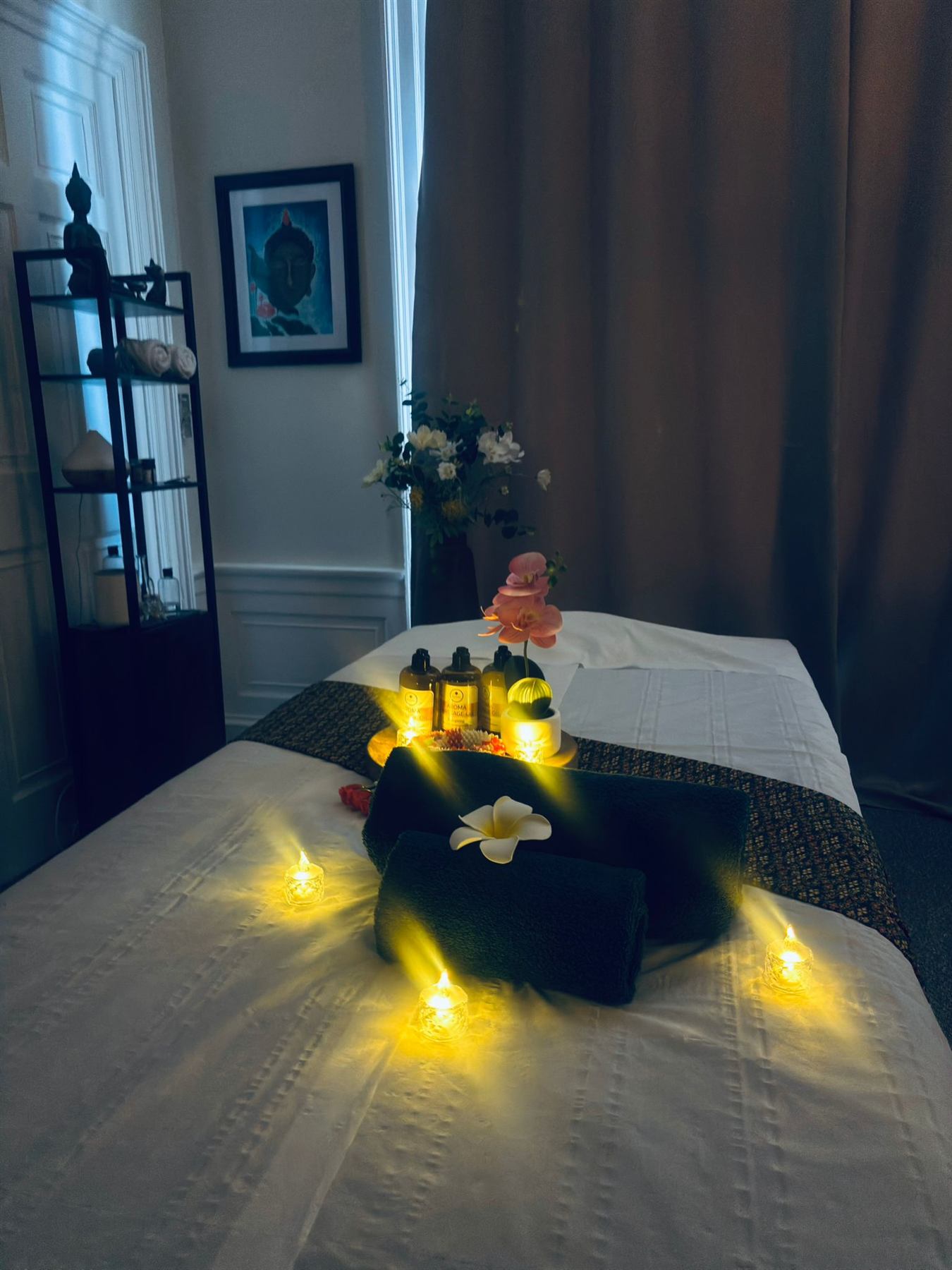 Massage room with soft lighting and towels